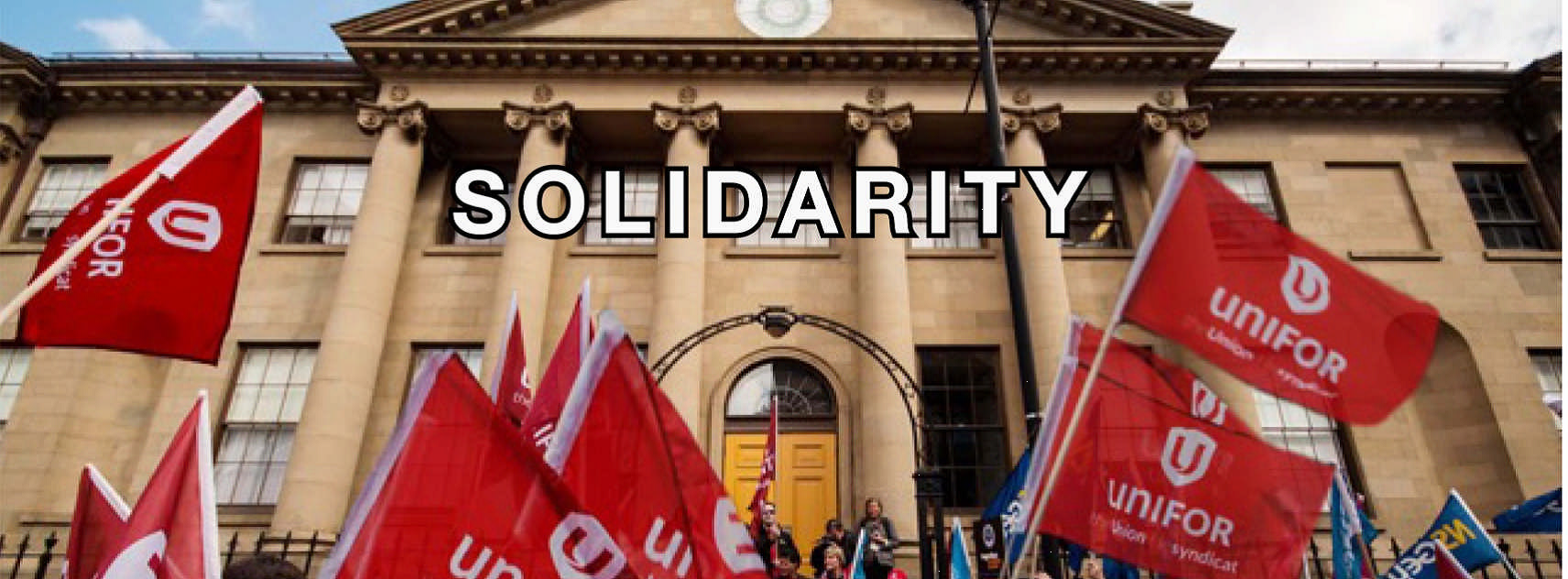 Unifor flags waving with the word Solidarity over the image