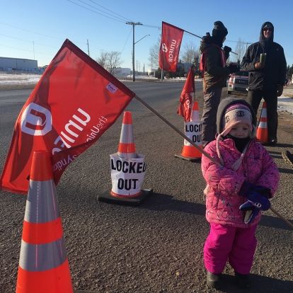 Little girl holding unifor flag